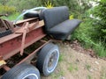 Old car back seat on boat trailer Royalty Free Stock Photo