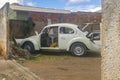 Old car in the backyard of workshop of funneling and painting of altomobile, going through the process of restoration