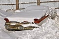 Old car buried in a snow bank