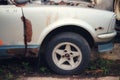 Old car chassis, old car wheels, photo cracks for background, surface copying, free space Choose a focus point