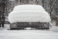 Old car covered with snow Royalty Free Stock Photo