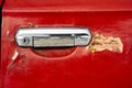 old car door handle close-up. The red door of an old car Royalty Free Stock Photo