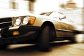 Old car driving fast Royalty Free Stock Photo