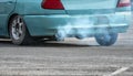 Old car emits pollutant out of the exhaust on street. Air pollution concept