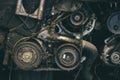 Old car engine spare part used closeup Serpentine belt vehicle machine dirty grease grunge with oil in garage