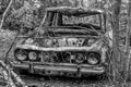 Black and white picture of an old abandoned car Royalty Free Stock Photo