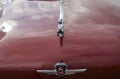 Close-up of shiny chrome plated deer on bonnet of the retro car GAZ-21 Volga