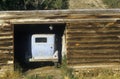 An old car in a log cabin garage in Snowmass, Colorado