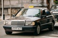 Old car 1996 Mercedes-Benz 190 E W201 sedan parking on street.