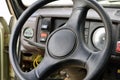 Old car panel dashboard of seventies vehicle with speedometer, and buttons of lights and fan, leather steering wheel, selective Royalty Free Stock Photo