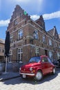 Old car parked in front of a bar Royalty Free Stock Photo