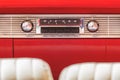 Old car radio inside a classic American car with chrome dashboard Royalty Free Stock Photo