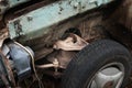 Old car. Rusty part. Close-up of a damaged car suspension part. Unusable car