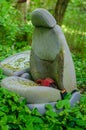 Old abandoned car seat covered in moss in the bush. Royalty Free Stock Photo