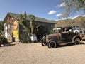 Old car at Route66 with a shell house