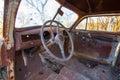 An Old Car Steering Wheel on a Farm Royalty Free Stock Photo