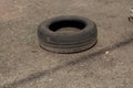 Old car tire on asphalt Royalty Free Stock Photo
