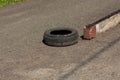 Old car tire on asphalt Royalty Free Stock Photo