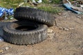 Old car tires left in the pile garbage area, environment concepts