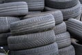 Old car tires, worn tread, worn rubber, a pile of old car wheels, a dump of worn tires from used cars. Environmental pollution Royalty Free Stock Photo