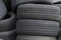 Old car tires, worn tread, worn rubber, a pile of old car wheels, a dump of worn tires from used cars. Environmental pollution Royalty Free Stock Photo