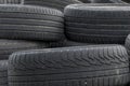 Old car tires, worn tread, worn rubber, a pile of old car wheels, a dump of worn tires from used cars. Environmental pollution Royalty Free Stock Photo