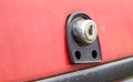 Old car trunk lock. Trunk lock details. Close-up of a handle to open the back door of a vintage red car Royalty Free Stock Photo