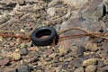 Old Car Tyre at a Small Harbour Location