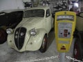 An old car with vintage parking meter