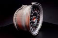 car wheels titanium rims after a traffic accident are gray in a dark room