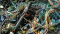 Old car wiring from several cars piled up.