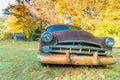 Old car wreck in a countryside field Royalty Free Stock Photo