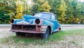 Old car wreck on a field Royalty Free Stock Photo