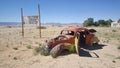 Old car wreck at Gas station Solitaire Royalty Free Stock Photo