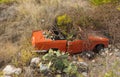 Old car wreck standing beside a road down the hill in andalusia. Royalty Free Stock Photo