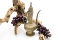 Old carafe with wine grapes