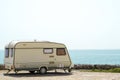 Old caravan on the shore Royalty Free Stock Photo