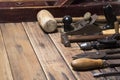 Old carpenter hand tools on wooden plank background Royalty Free Stock Photo