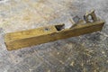 Old carpenter tool planer on vintage wooden background Royalty Free Stock Photo