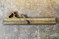 Old carpenter tool planer on vintage wooden background Royalty Free Stock Photo