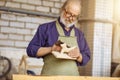 Old carpenter working with glasspaper Royalty Free Stock Photo