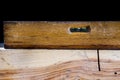 Old carpentry tools in a workshop. Spirit level in a wooden case Royalty Free Stock Photo