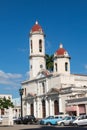 Old cars parked in the Jose Marti Park, in front of the Purisima Concepcion Cathedral. Cienfuegos, Cuba.