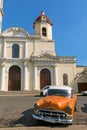 Old cars parked in the JosÃÂ© MartÃÂ­ Park, in front of the Purisima Concepcion Cathedral. Cienfuegos, Cuba.