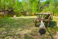 The old cart, lake and timber hata house, Mamajeva Sloboda Cossack Village, Kyiv, Ukraine Royalty Free Stock Photo