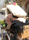 old cart with a mattress and other items of poor immigrant famil