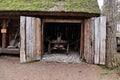 An old cart stands in a thatched wooden shed in the village Royalty Free Stock Photo