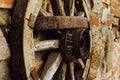 A wheel from an old cart hangs on the wall Royalty Free Stock Photo