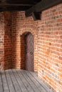 Old carved door to the room in the castle of the Teutonic Knights. Door in the castle museum Royalty Free Stock Photo