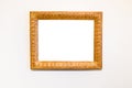 Old carved wide wood picture frame on white wall Royalty Free Stock Photo